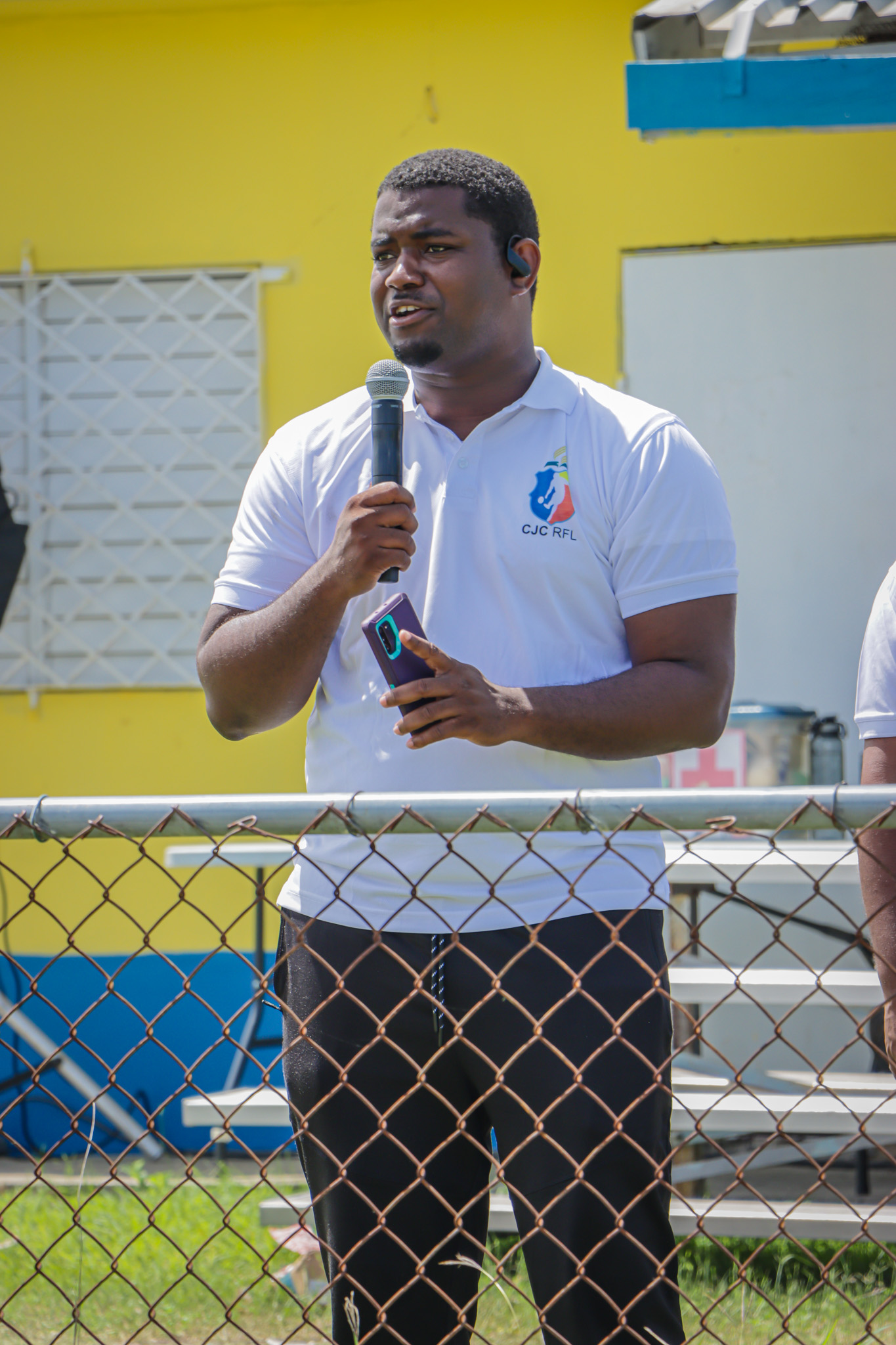 CJC Youth Director, Pastor Dwayne Scott, greets attendees at the opening ceremony for the Recreation League. Photo credit: Ragel Barrett
